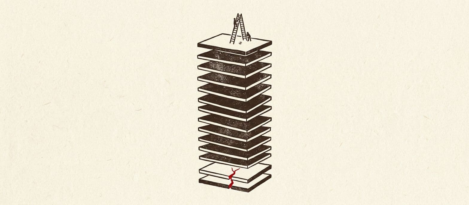 A cross-section of stacked floor plates with a small ladder on the top one and a single red crack through one of the lowest plates